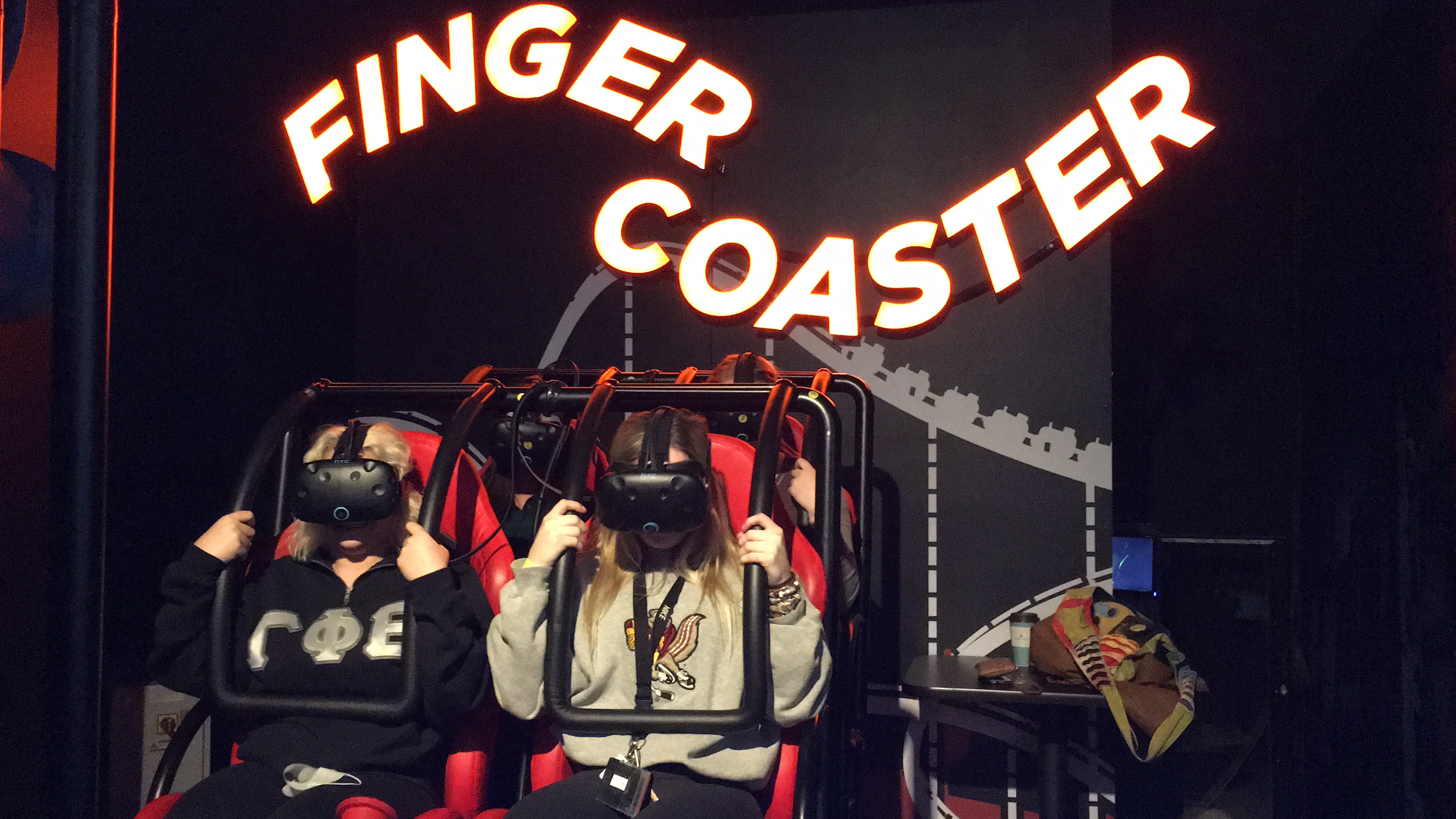 players riding finger coaster